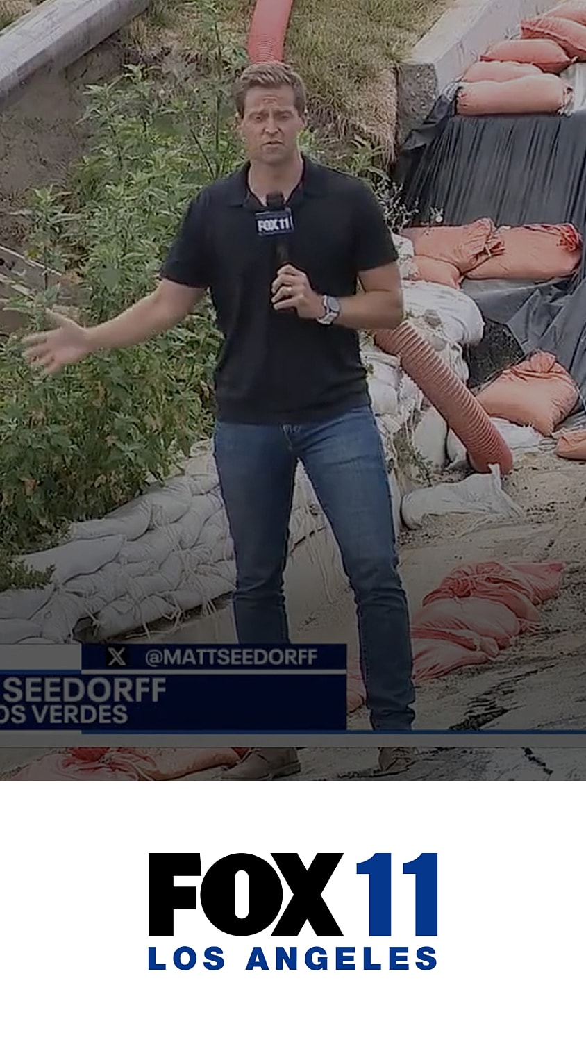 Reporter reporting from a weather-affected area.