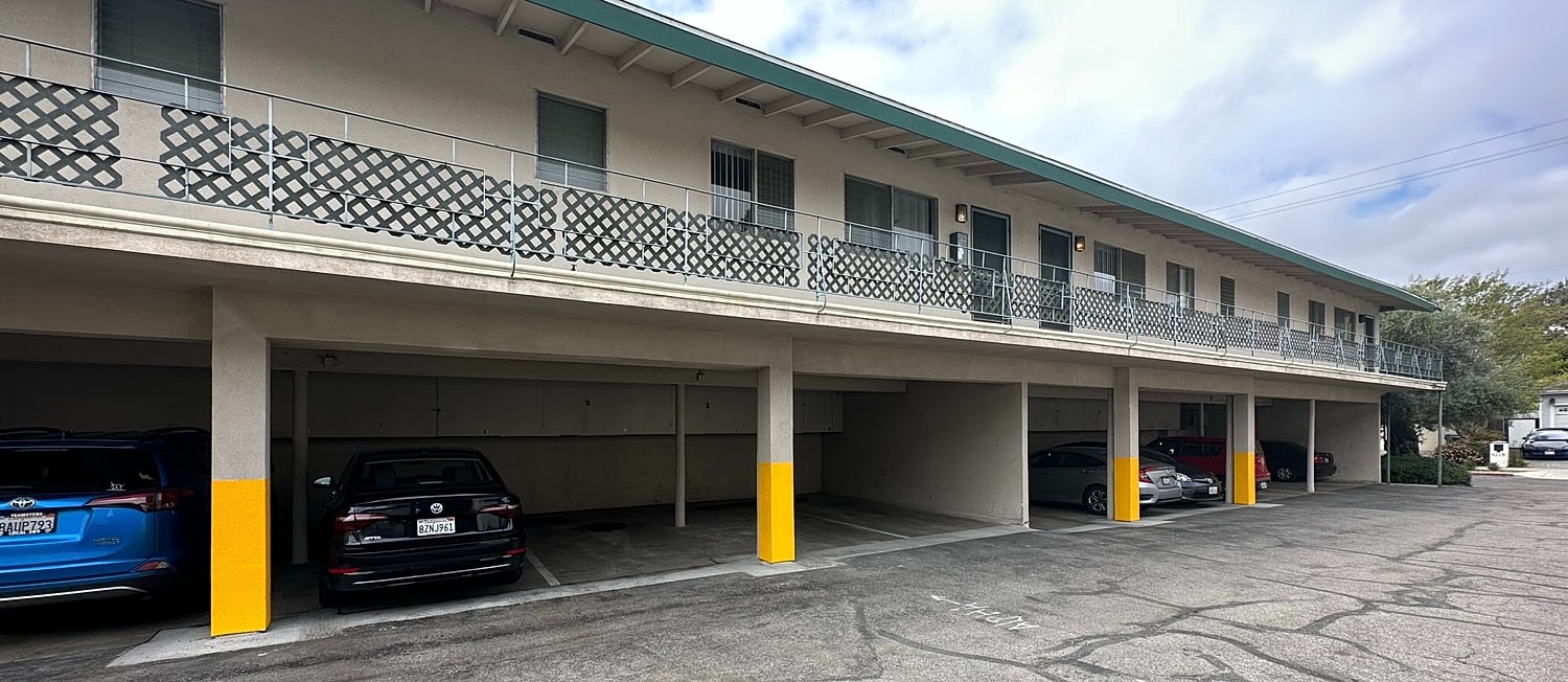 Parking area beneath a residential building.