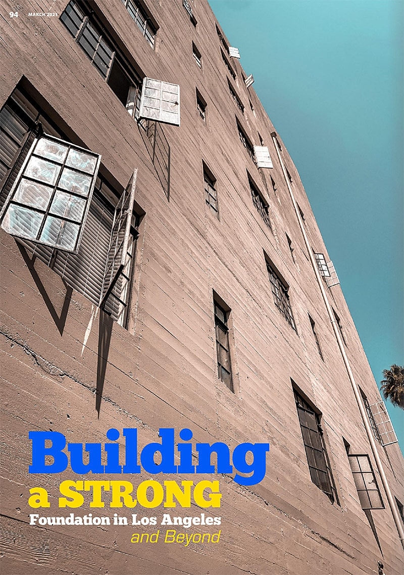 Building facade with open windows against blue sky