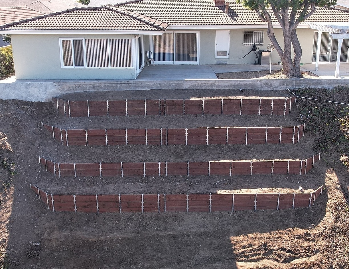 Stair-step garden beds in residential yard.