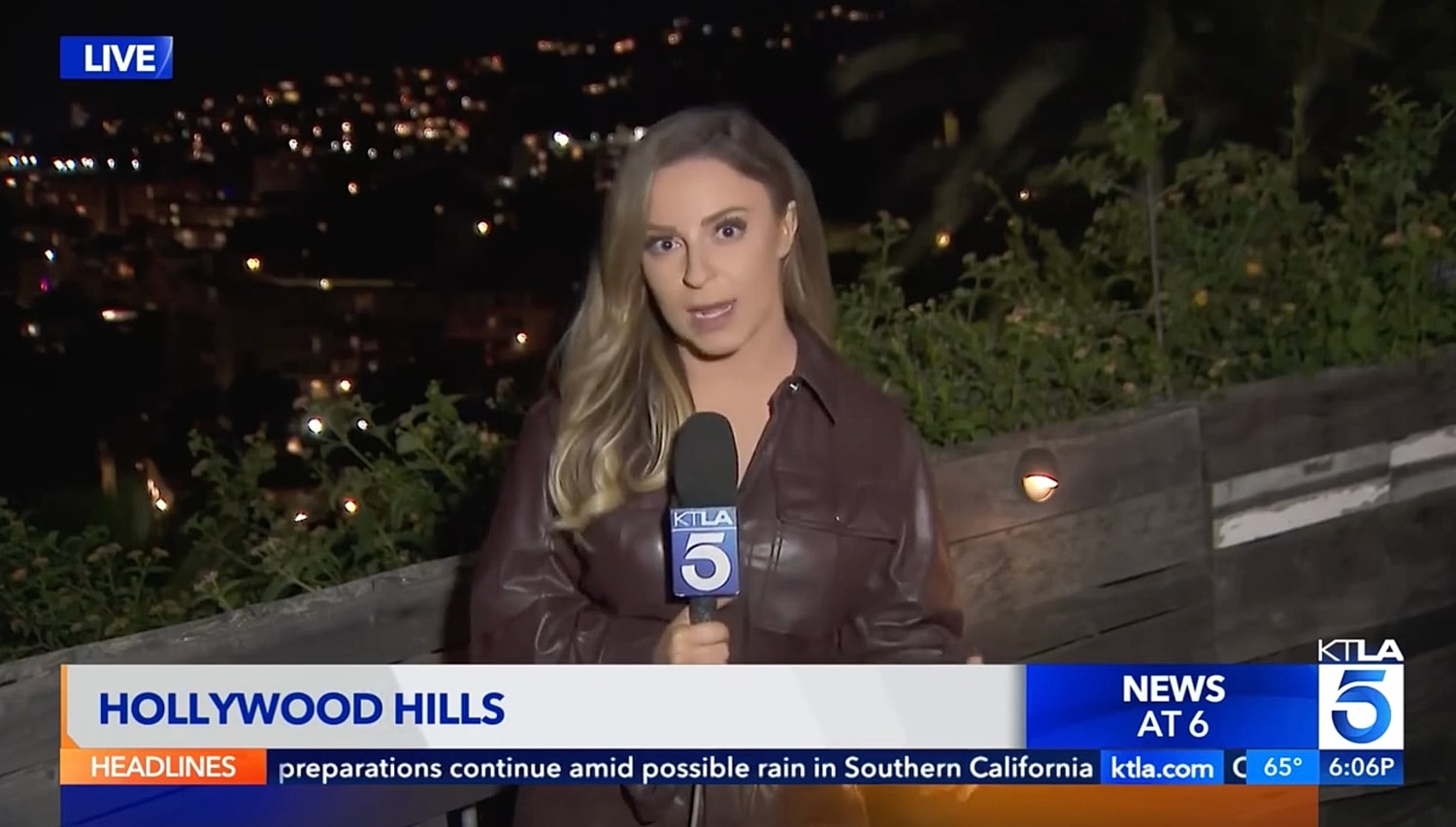 News reporter in Hollywood Hills at night.
