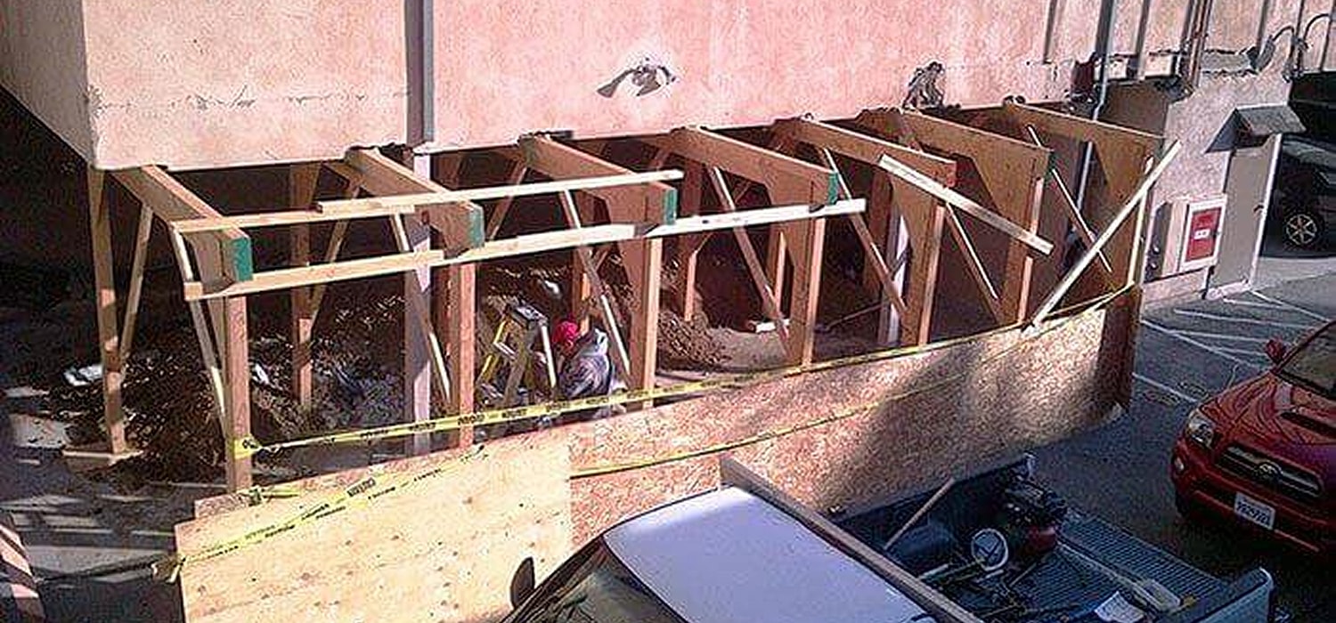 Construction area with plastic covering insulation work.