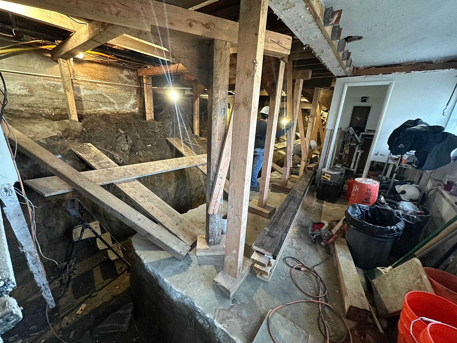 Interior construction site with exposed foundation work.