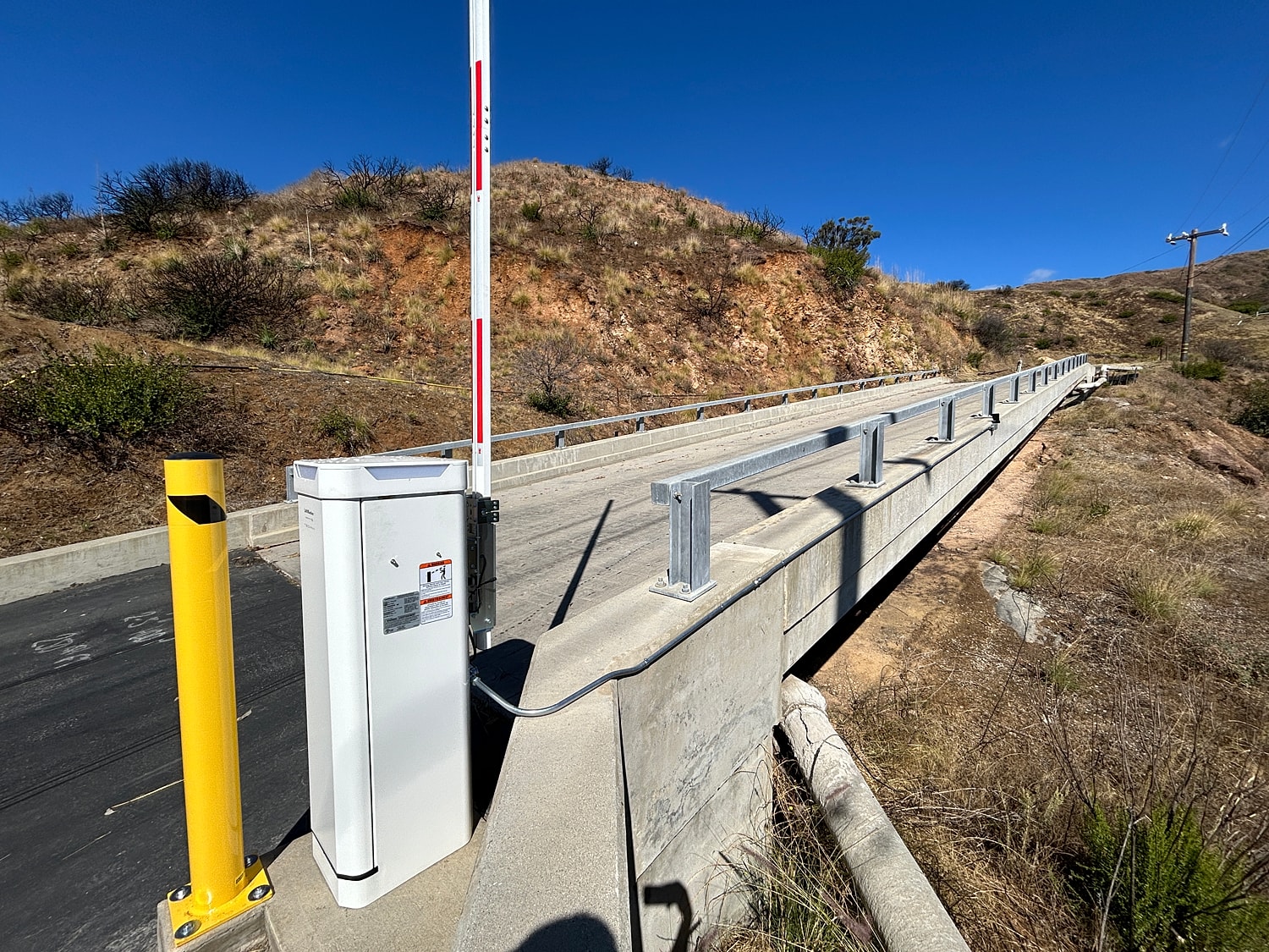 Automated gate at a roadway entrance.