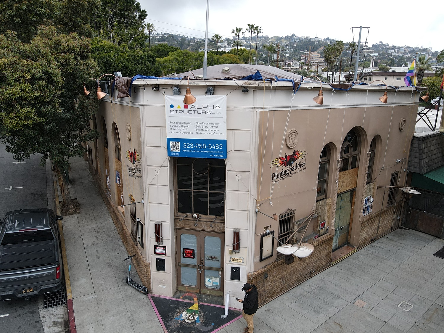 Historic building with signage and outdoor decor.