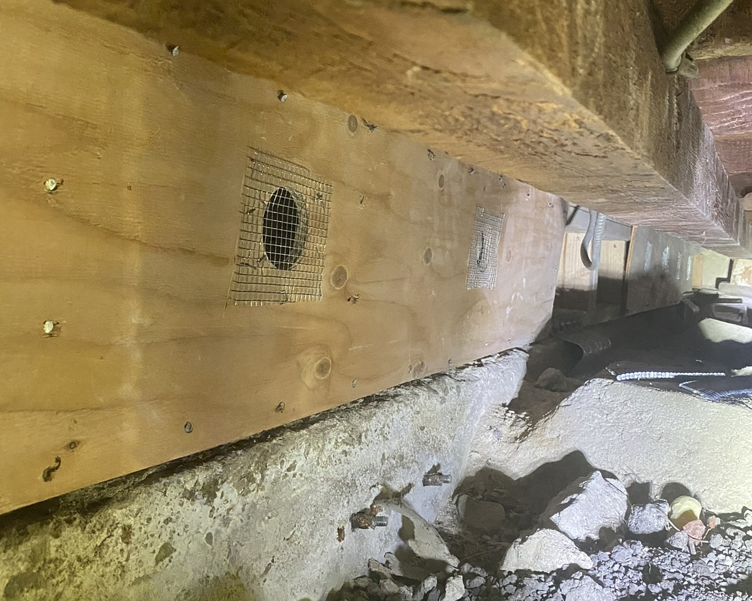 Wooden panel with ventilation holes installed.