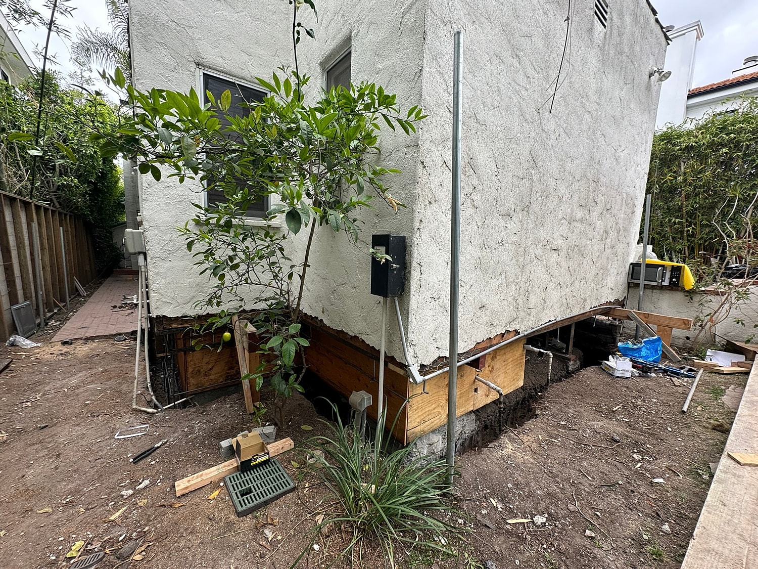 Home renovation with exposed foundation work.