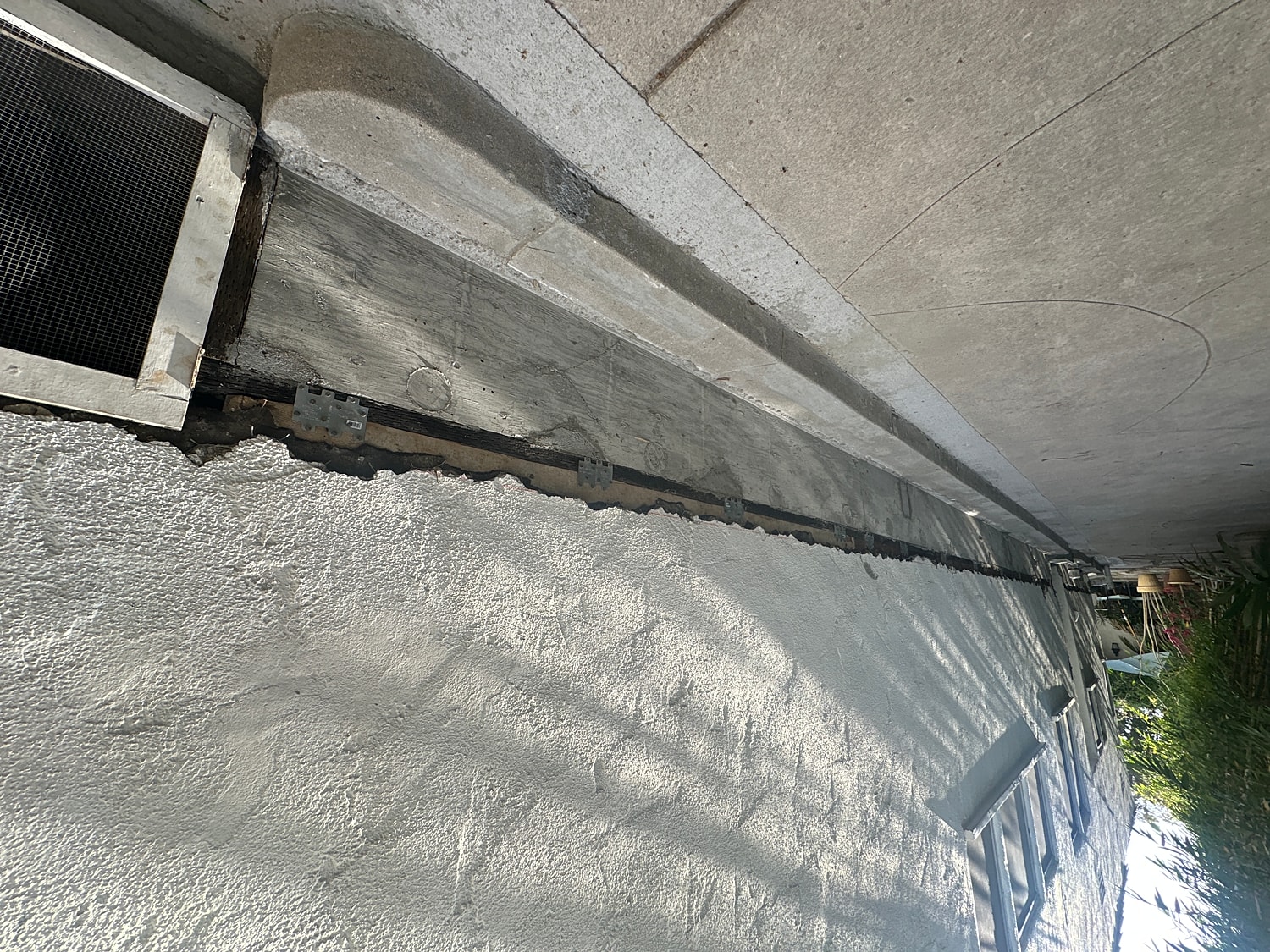 Wall with foundation and drainage details visible