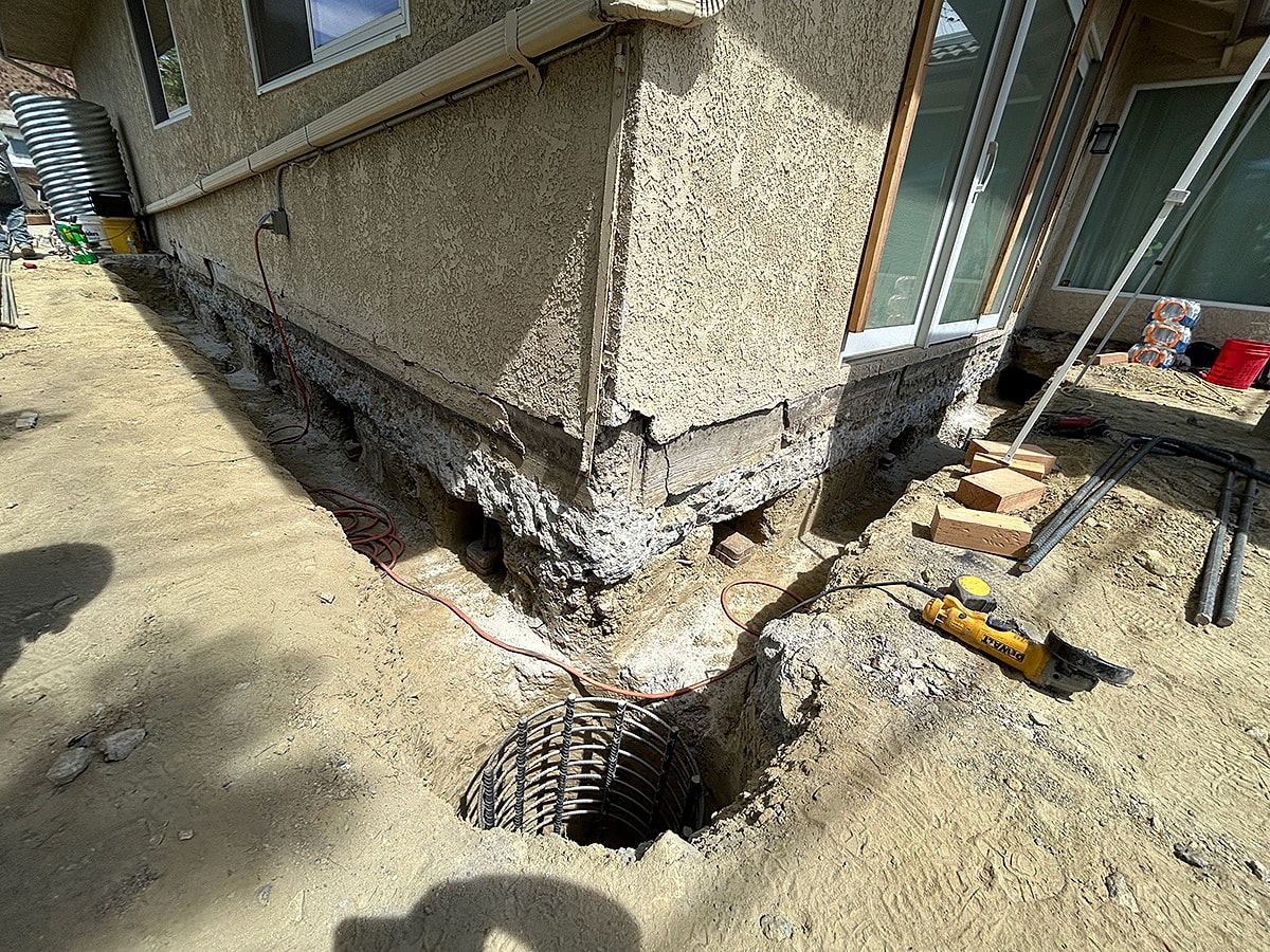 Foundation work and construction site with equipment.