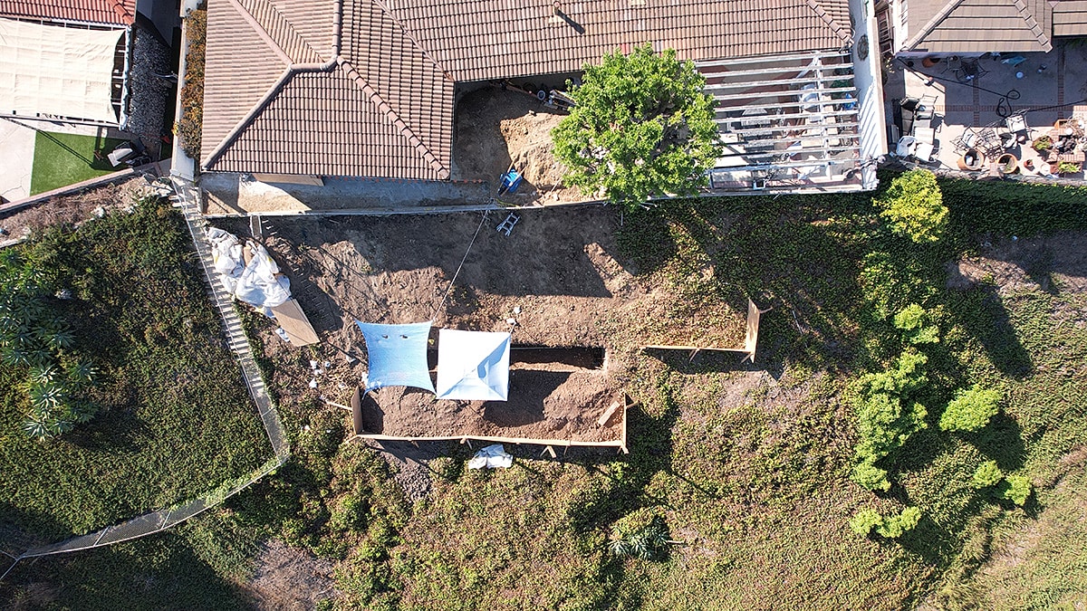 Aerial view of construction site with tents.