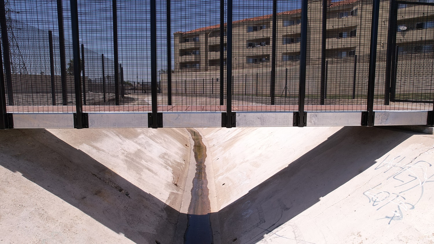 Bridge over a drainage ditch in urban area.