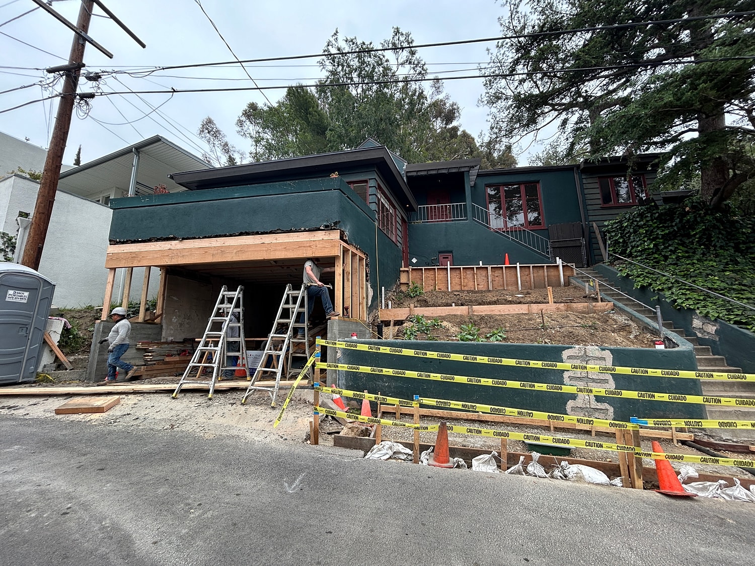 Home renovation under construction with caution tape.