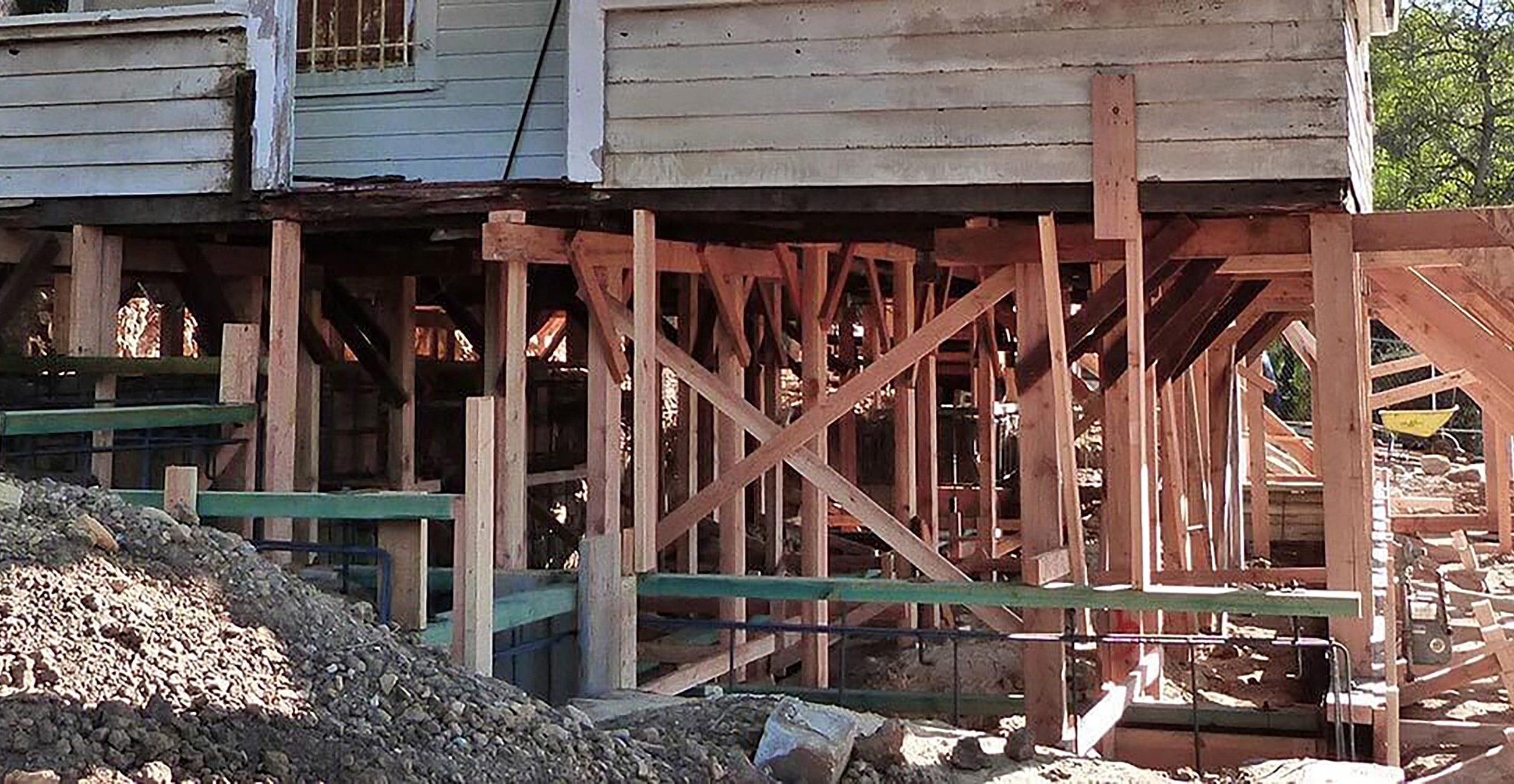 House elevated on wooden supports for renovation