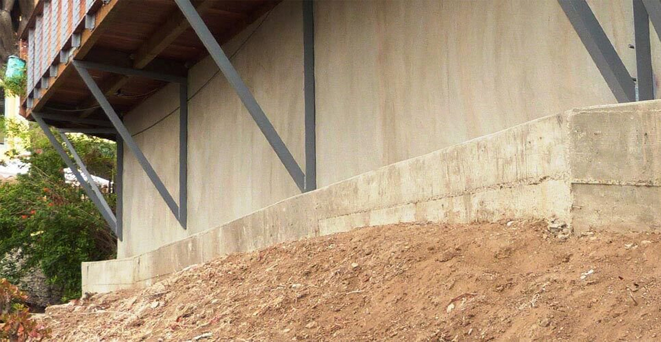 Building foundation with diagonal support beams.