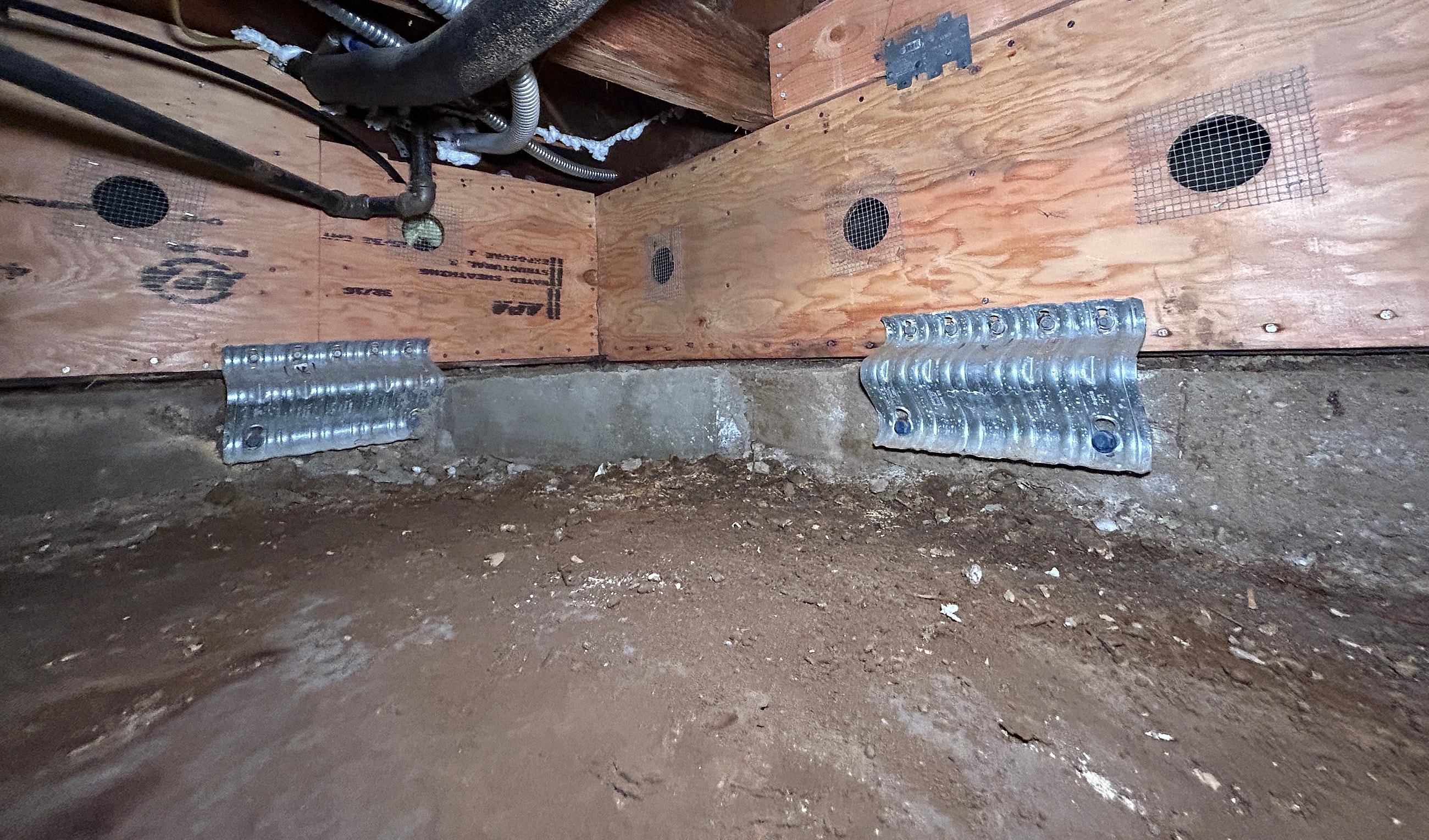 View of a crawl space with ventilation.